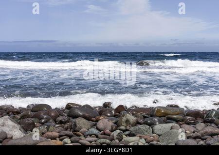 Atlantic Ocean waves breaking on rocky volcanic shoreline in Gran Canaria, Spain. Stock Photo