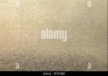 Close-up texture of brushed metallic surface with subtle scratches and reflections Stock Photo