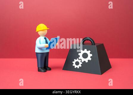 An engineer is working on a solution to a technological problem. Innovations and technological improvements, industrial research and development of ad Stock Photo