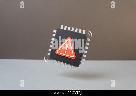 Microchip with warning. Shortage of chips and electronic components. Factory defects, damaged hardware and risks from defective semiconductor batches. Stock Photo