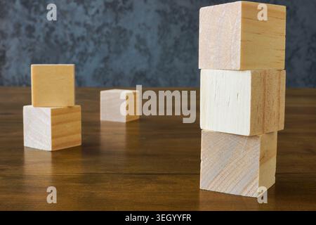 Wooden blocks stacked on table for business growth concept. Stock Photo