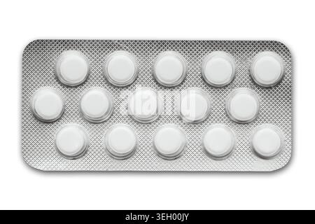Blister pack with white pills isolated on white background. Pharmaceutical medication and healthcare treatment concept closeup image. Stock Photo