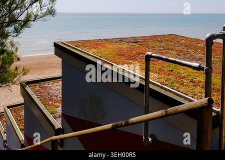 Colourful Beach Huts on the seafront in Folkestone, Kent, England, United Kingdom Stock Photo