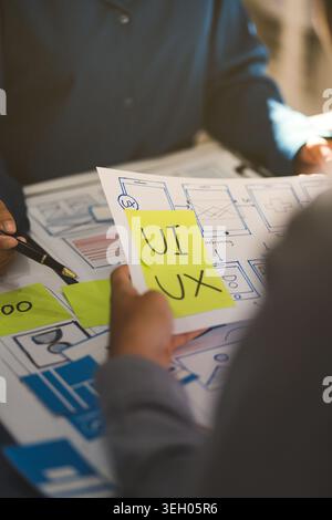 Team of Program Developer Collaborating on UXUI Design Planning in a Modern Office Environment Stock Photo