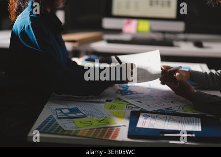 Team of Program Developer Collaborating on UXUI Design Planning in a Modern Office Environment Stock Photo