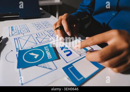 Team of Program Developer Collaborating on UXUI Design Planning in a Modern Office Environment Stock Photo