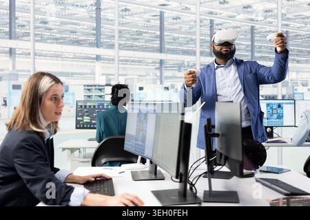 Scientist using VR goggles to design energy efficient semiconductors with sustainable technology. African american expert using virtual reality simulation to upgrade microchip hardware production Stock Photo