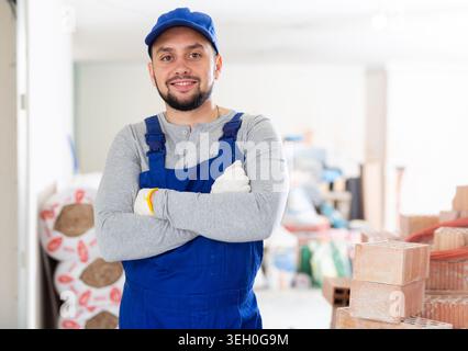 Portrait of builder in process of finishing work Stock Photo