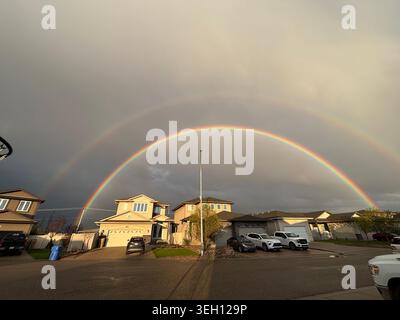 Double Rainbow Over Suburban Houses Stock Photo