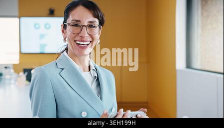 Woman, portrait and analyst with tablet for business analytics, performance or statistics in office. Happy, female person or data manager with smile Stock Photo