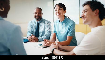 Business people, meeting and interview with smile for hiring, recruiting or conversation in office. Happy, group or employees talking with candidate Stock Photo