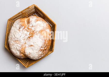 Freshly baked bread on basket against natural background. top view bread copy space. Stock Photo