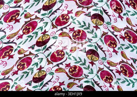 Background, fabric texture with a pomegranate pattern. Concept: interior, cosmetics packaging, textile prints Stock Photo