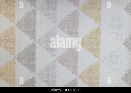 Geometric triangle pattern on light grey fabric background Stock Photo