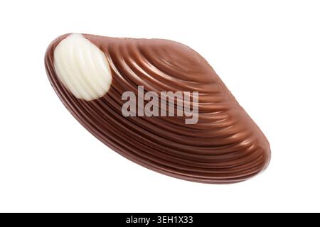 Brown and white chocolate seashell shaped candy isolated over white Stock Photo
