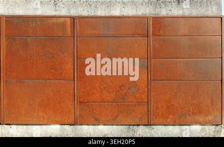 Rusted steel plates with concrete borders. Background and texture. Stock Photo