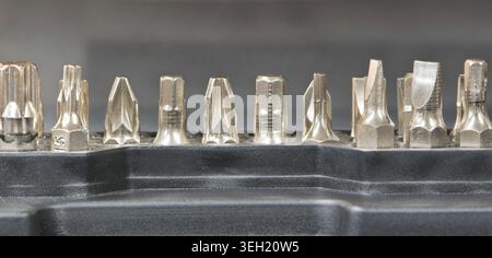 Drill screwdriver bits socket set network tool repair kit metal fastener mechanical components. Stock Photo