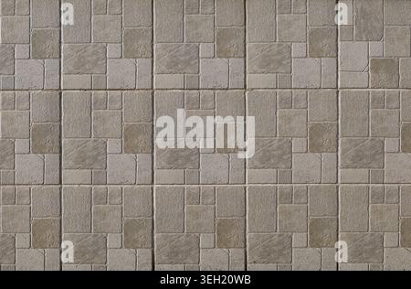 Squared stoneware tiles with stone effect for exterior wall cladding. Colors are shades of gray and brown. Background and texture. Stock Photo