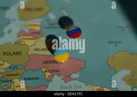 Map of Eastern Europe with round flag pins placed on Ukraine and Russia near Moscow, geopolitics and international relations conflict concept Stock Photo