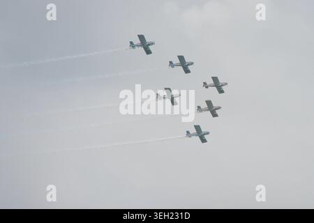 Five planes soar in perfect formation. Stock Photo