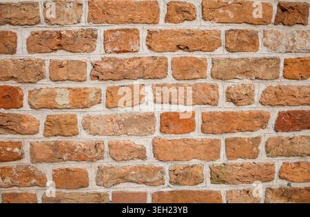 Real old red brick wall close up background Stock Photo