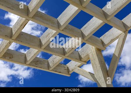 Modern white pergola structure photographed against a deep blue sky in Agaete, Gran Canaria, Canary Islands, Spain. Stock Photo