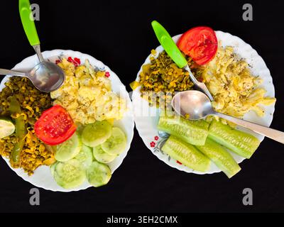 healthy homemade breakfast plates with scrambled eggs cucumber and sprouted moong salad Stock Photo