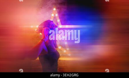 Background room with dancing girl in headphones - spotlights and lights, abstract purple background with neon glow Stock Photo