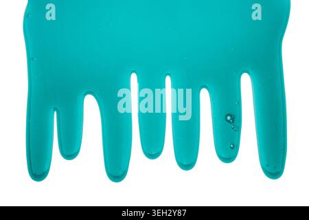 Blue liquid transparent gel dripping down against white background. Stock Photo