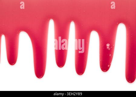 Purple liquid transparent gel dripping down against white background. Stock Photo