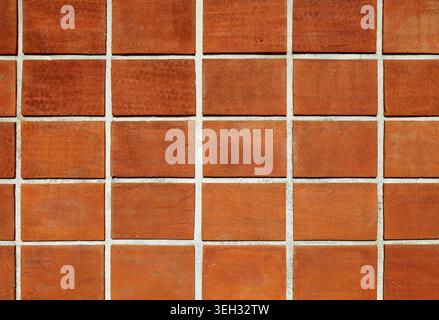 Terracotta tiled wall. Background and texture. Full frame. Stock Photo