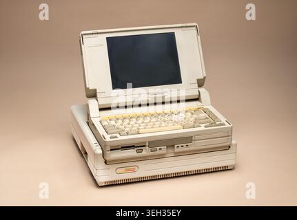 Pavia, Lombardy, Italy-March 30, 2026: Compaq SLT 286 vintage portable computer from the late 1980s. Beige design with LCD screen and full keyboard, o Stock Photo