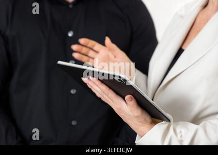 Business Professionals Discussing Project Using Digital Tablet Stock Photo