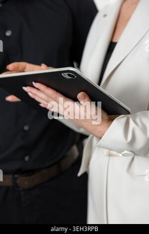 Business Professionals Using Digital Tablet During Meeting Stock Photo