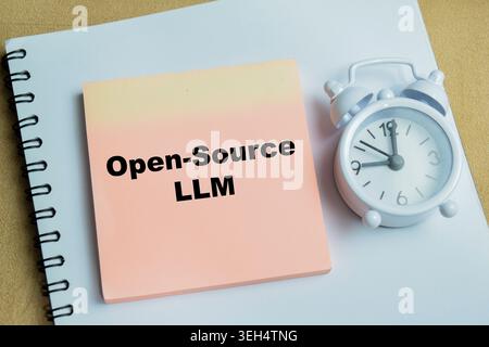 Concept of open-source LLM write on sticky notes isolated on Wooden Table. Stock Photo
