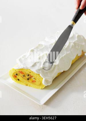 Spread the stollen with whipped cream (film recipe: Christmas stollen with exotic fruit) Stock Photo