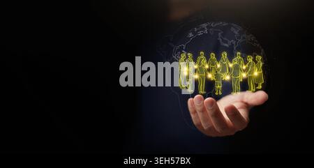 Hand holding global community connection circle icon with world map on dark copy space. Social bond, teamwork, diversity, family support, unity, peopl Stock Photo