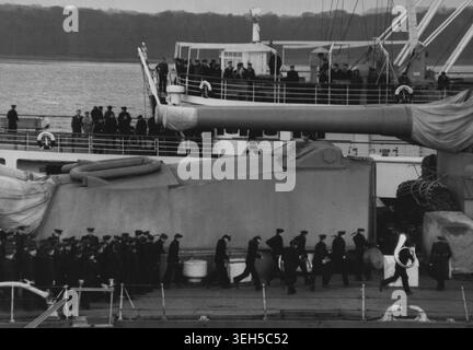 They're Doubling HomeSoviet sailors, some with band instruments, doubling off the battleship 'Royal Sovereign' to join the Russian transport 'Ukrainia' for home after the official handing over of the warship to Britain.The 29,150tons battleship has been on load to Russian since 1944.She is over 30 years old and will probably be scrapped. February 09, 1949. Stock Photo