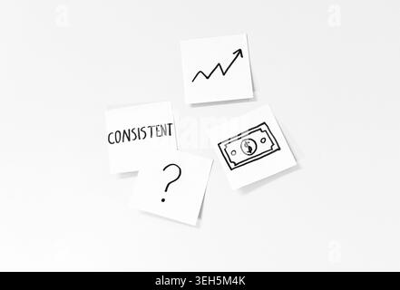 Sticky notes with a money symbol, upward chart, the word consistent and a question mark illustrating strategic planning, problem solving and steady fi Stock Photo