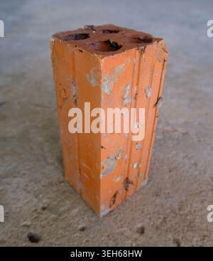 Old Hollow Red Clay Brick On Concrete Floor Stock Photo