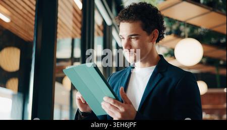Tablet, research and businessman in office with email for feedback on investment proposal. Digital technology, communication and financial manager Stock Photo