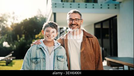 Smile, portrait and father with son outdoor of home for bonding, support and connection. Happy, love and commitment with man and child in backyard of Stock Photo
