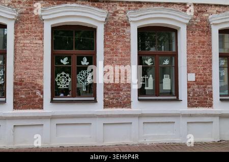 Red Brick Building Facade with Two Windows Stock Photo