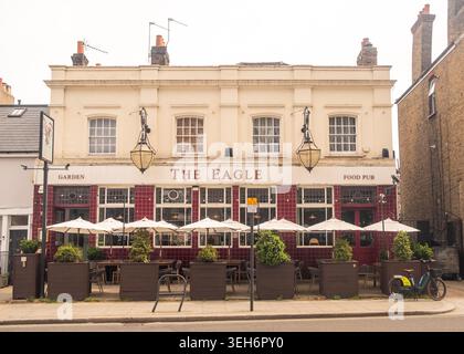 LONDON - APRIL 9, 2026: SHEPHERDS BUSH – The Eagle traditional food pub with garden seating Stock Photo