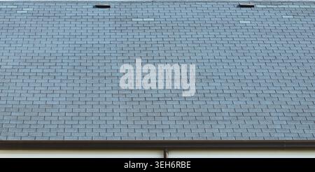 Blue asphalt roof shingles Background and texture. Full frame. Stock Photo