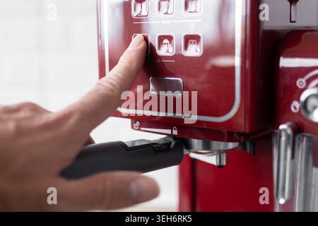 Preparing espresso coffee in a modern kitchen.Close up. Stock Photo