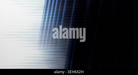 A dynamic abstract composition showing a digital glitch effect with horizontal blue and white streaks fading into a deep black background. Stock Photo