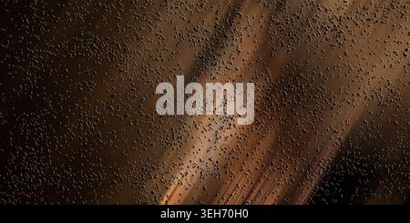 A dark, warm-toned abstract background with subtle light streaks and a uniform distribution of small black particles throughout. Stock Photo