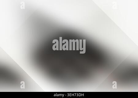 An abstract background featuring smooth, blurred gradients with a subtle diamond-shaped overlay, creating a soft and modern aesthetic. Stock Photo