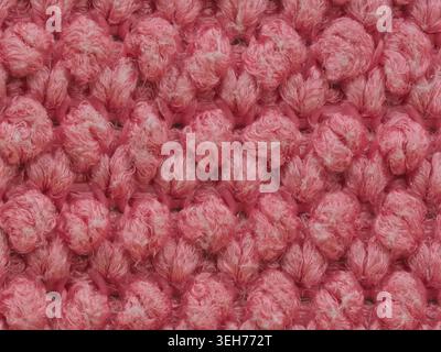 Extreme macro photography of a pink microfiber cloth texture showing individual fiber loops Stock Photo